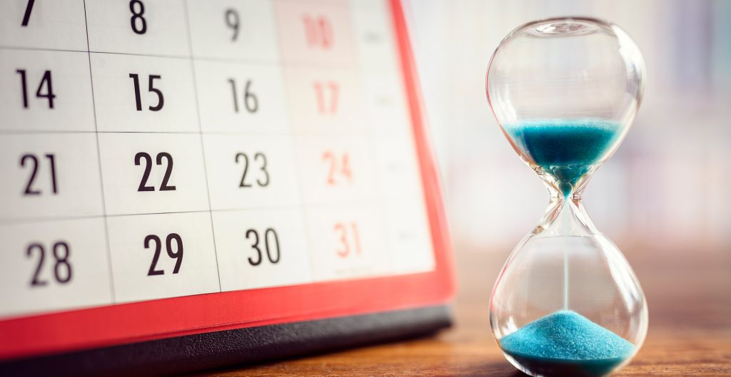 hour-glass-with-sand-counting-down-on-desk-next-to-calendar. Schedule a meeting anytime with one of Nova's representatives